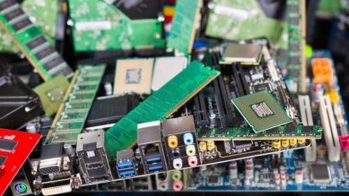 Electronic waste recycling. Pile of PC computer parts.