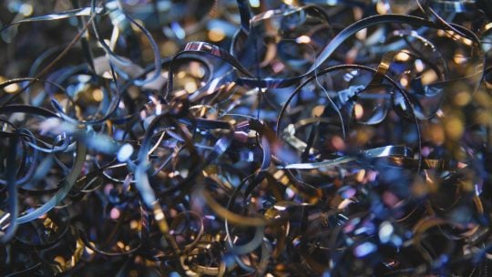 Iridescent shine of metal shavings during recycling process