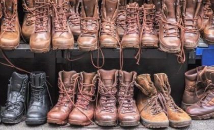 Secondhand combat brown boots on display at Brick Lane Sunday market in London